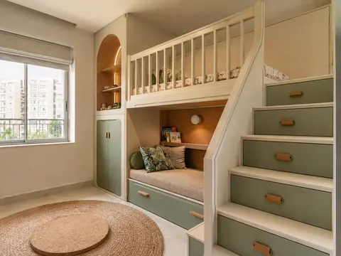 The secret reading stair: Bunk with concealed reading stair, Ivory cabinetry and Sage green fronts